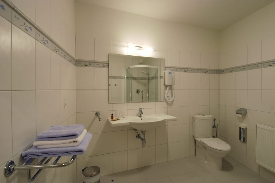 Designer toiletries, hair dryer, bathrobes, slippers