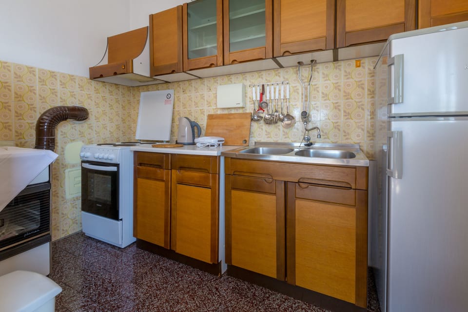 Apartment, 2 Bedrooms, Sea View | Private kitchen | Fridge, oven, stovetop, coffee/tea maker