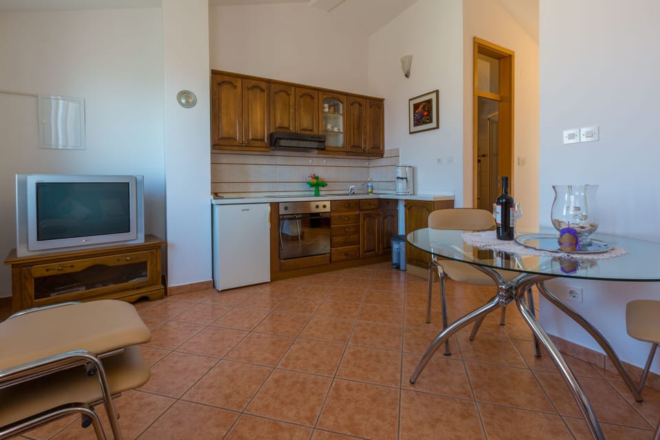 Apartment, 1 Bedroom, Sea View | Living area | TV