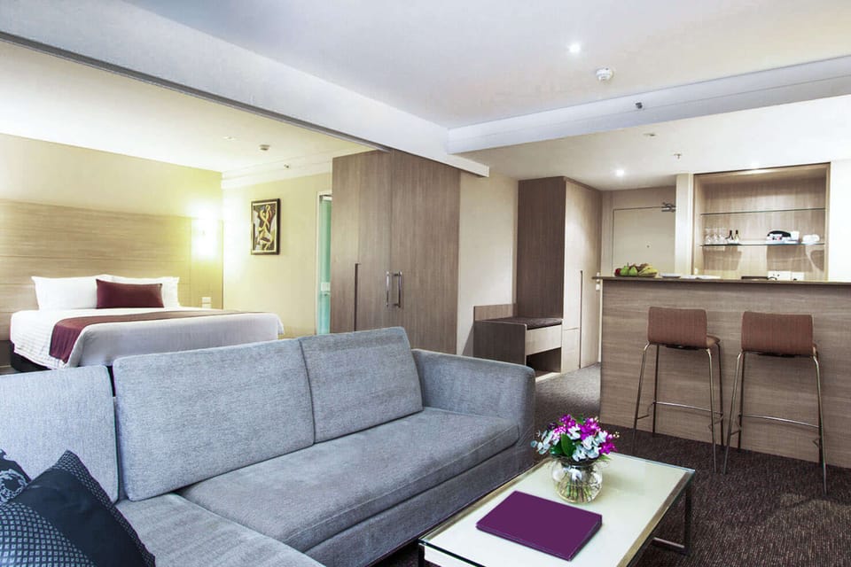 Executive Suite, 1 King Bed, Balcony | In-room safe, desk, blackout drapes, iron/ironing board