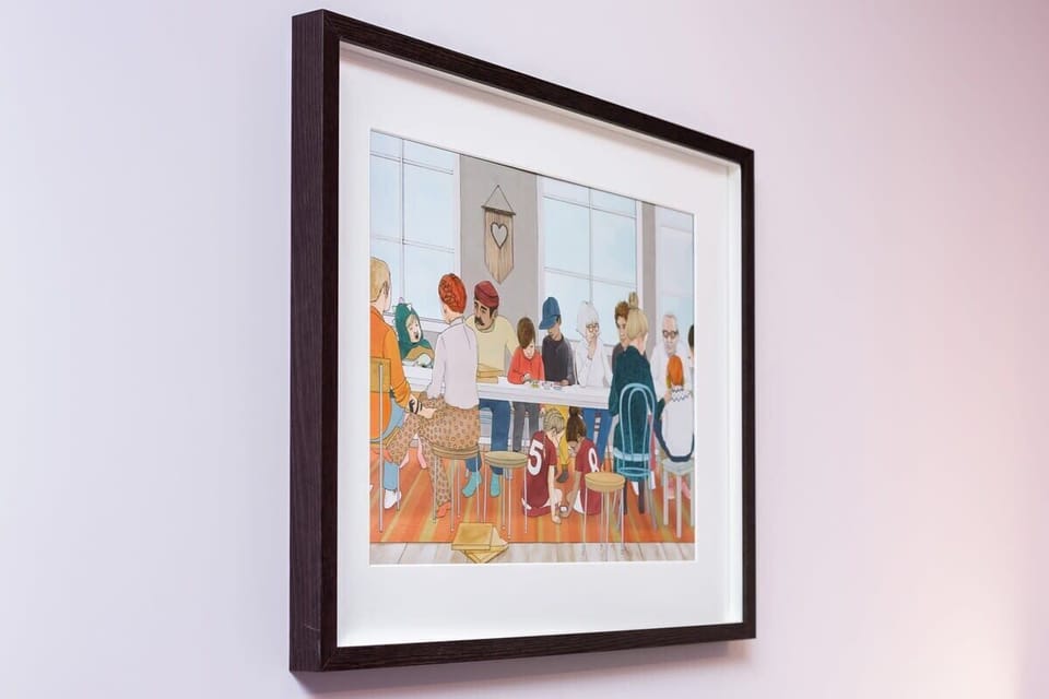 A framed piece of art adorning the wall, contributing an artistic touch to the living space.