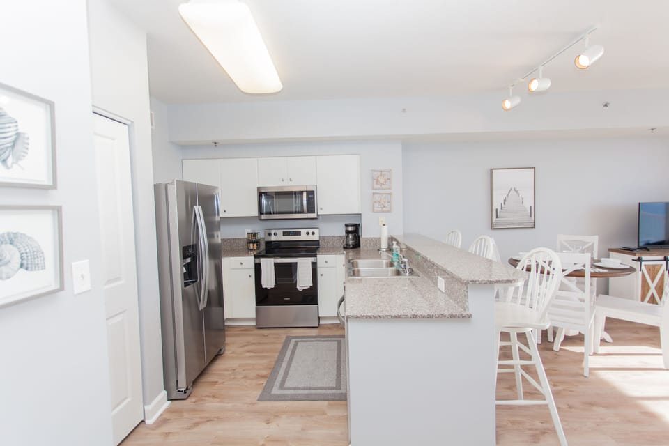 Another view of the open floor kitchen into the living room
