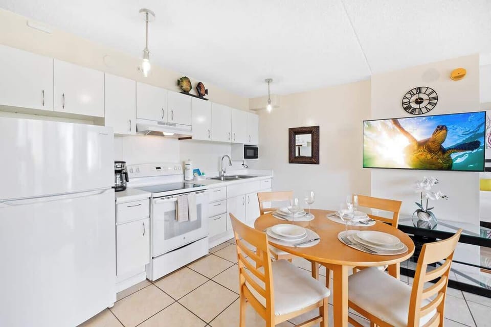 Fully equipped kitchen and dining table for up to four people.
