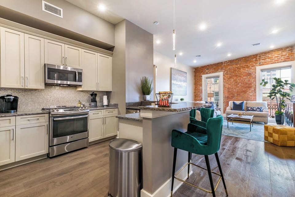 Cook and dine easily in the fully stocked kitchen, equipped with all stainless steel appliances, gas range, basic cookware, and a dining area for a comfortable meal at home. Entertain at the bar with seating for five.