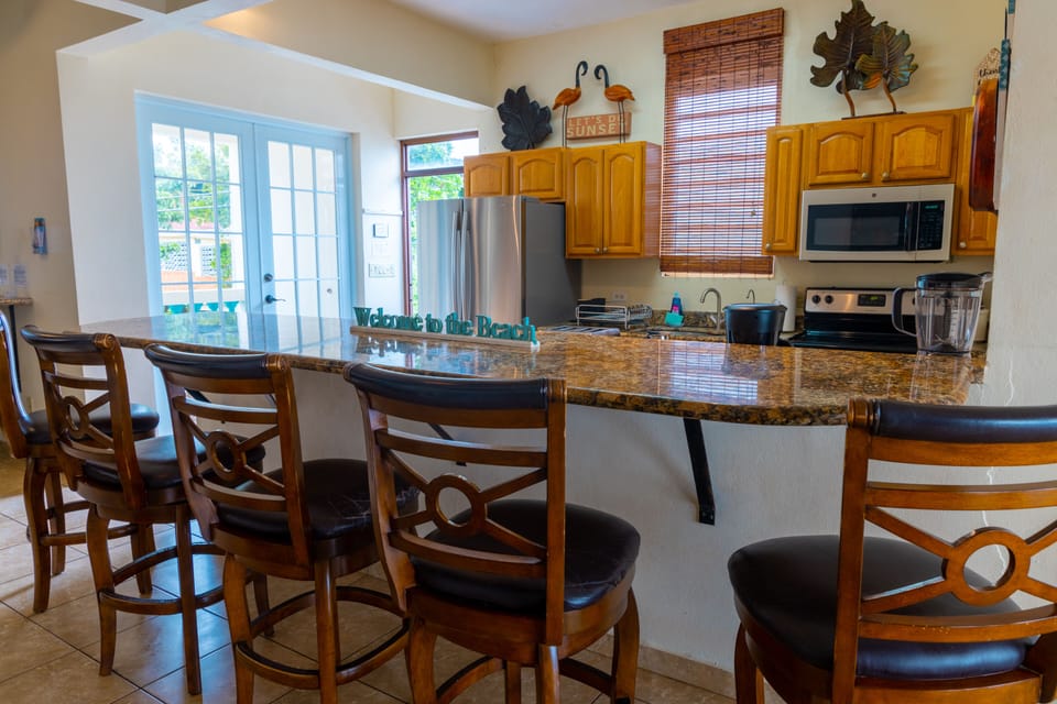 Panoramic Villa, 5 Bedrooms, Hot Tub, Oceanfront | Private kitchen | Highchair, dining tables