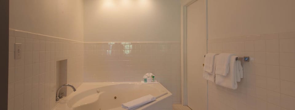 Honeymoon Room, Jetted Tub | Bathroom | Combined shower/tub, hair dryer, towels
