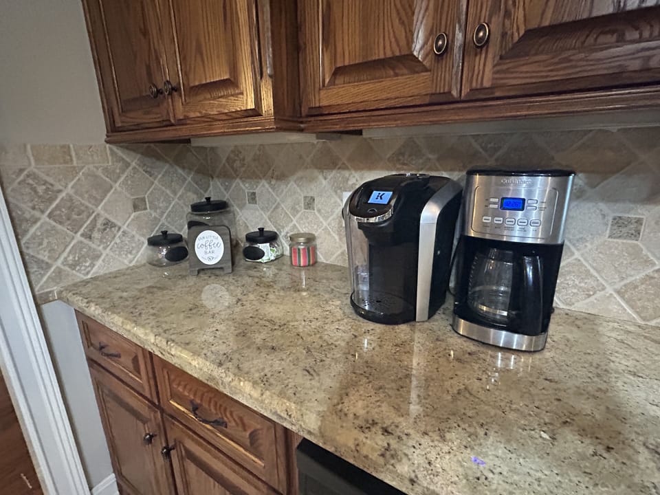 Coffee bar with Keurig and standard coffee maker.
