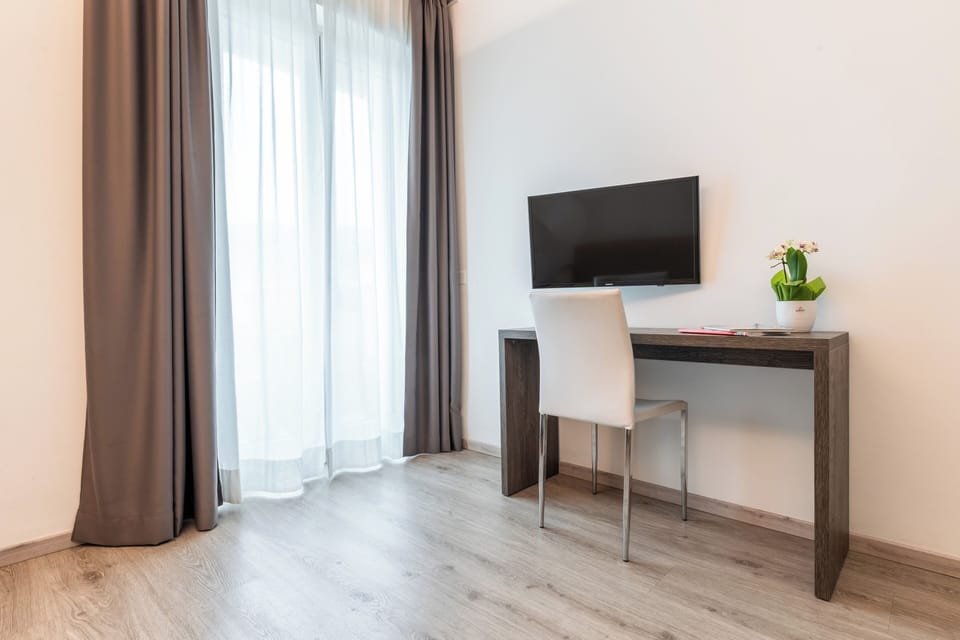 Signature Suite, 2 Bedrooms | Living area | LCD TV