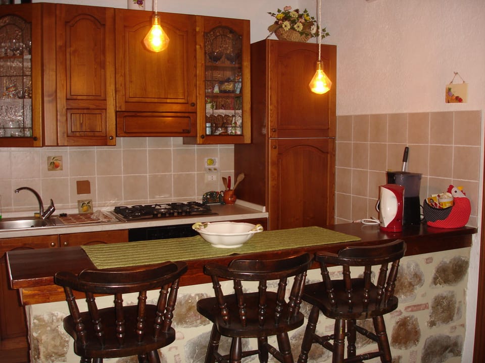 Comfort Apartment, Pool View (Giulia) | Private kitchenette | Fridge, microwave, oven, stovetop