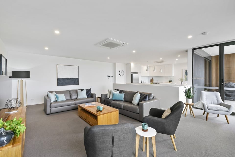 Open plan living, kitchen, dining area with 2 balconies and Weber BBQ