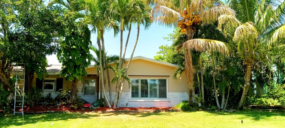 Front of property. Rental w/ private entrance around back. Solar panels on roof.