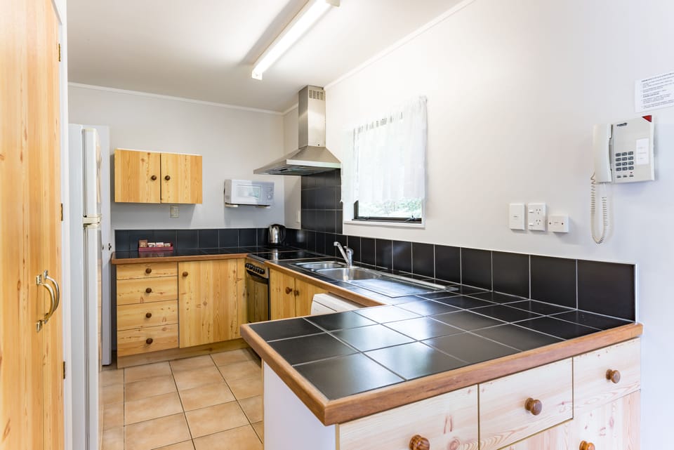 Family Apartment, 2 Bedrooms | Private kitchen | Mini-fridge, microwave, coffee/tea maker, toaster