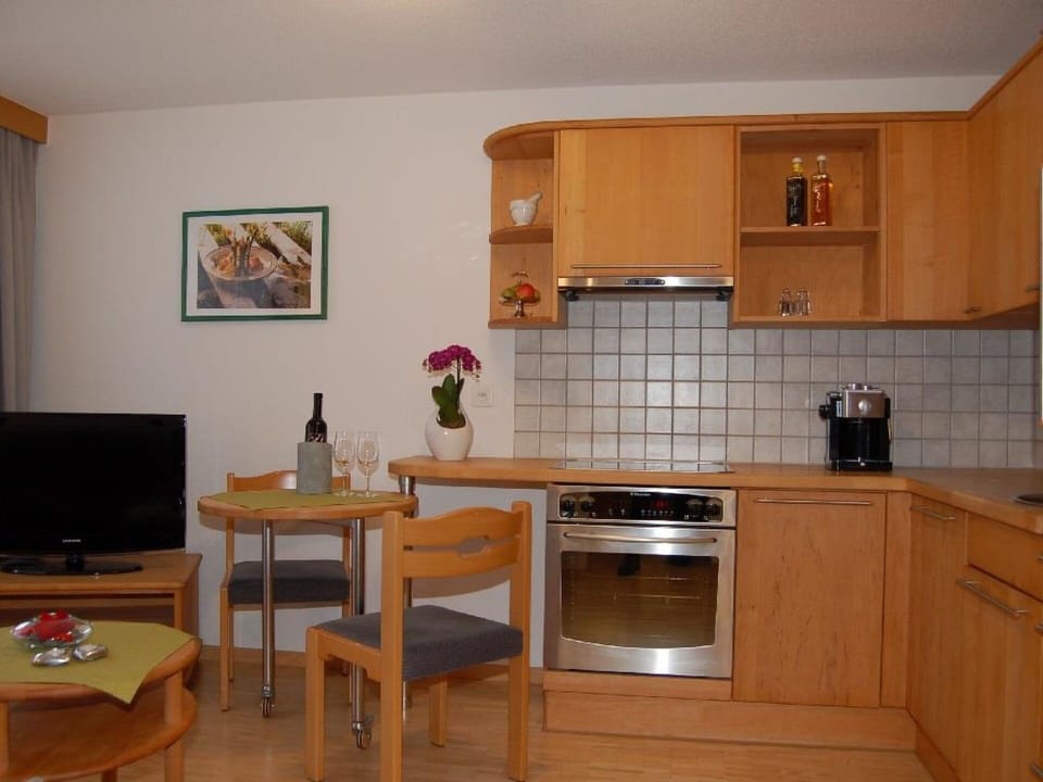 Property, Furniture, Countertop, Table, Cabinetry, Wood, Kitchen Appliance, Kitchen Stove, Building, Picture Frame
