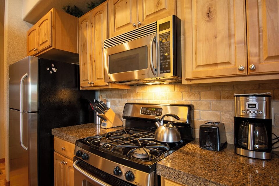 Your fully-equipped kitchen awaits with granite counters, stainless appliances, and everything you need to create memorable meals during your stay.