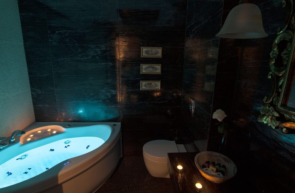 Executive Suite, Fireplace, Mountain View | Bathroom | Designer toiletries, hair dryer, bathrobes, slippers