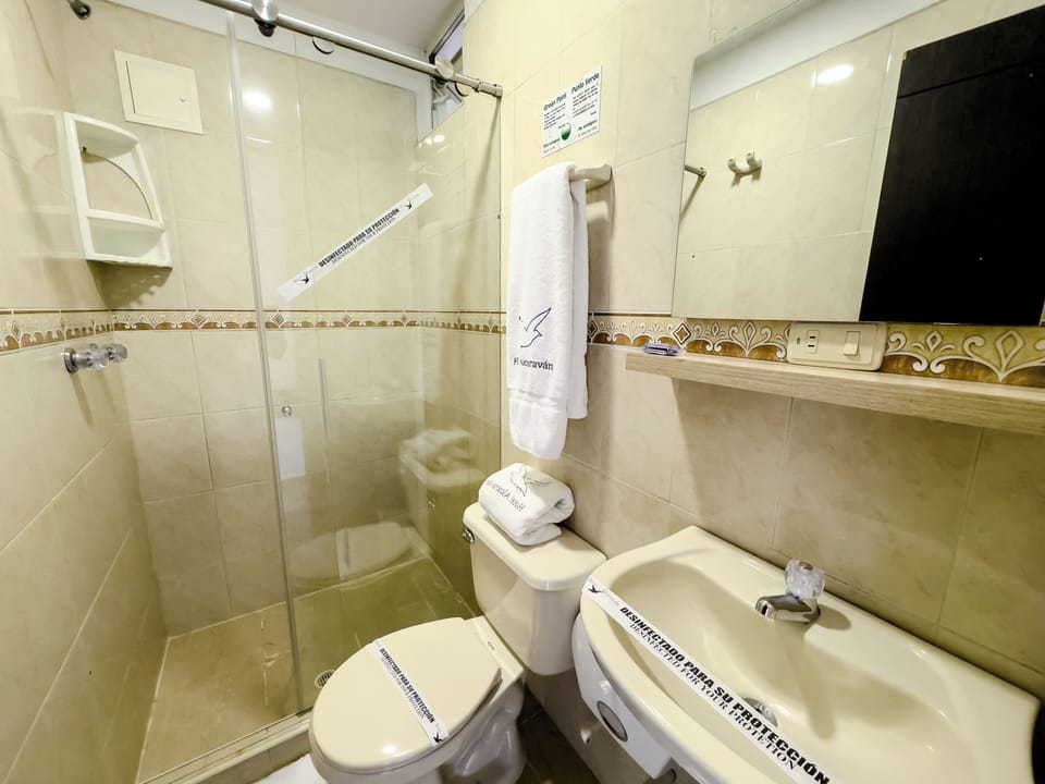 Shower, rainfall showerhead, hair dryer, towels
