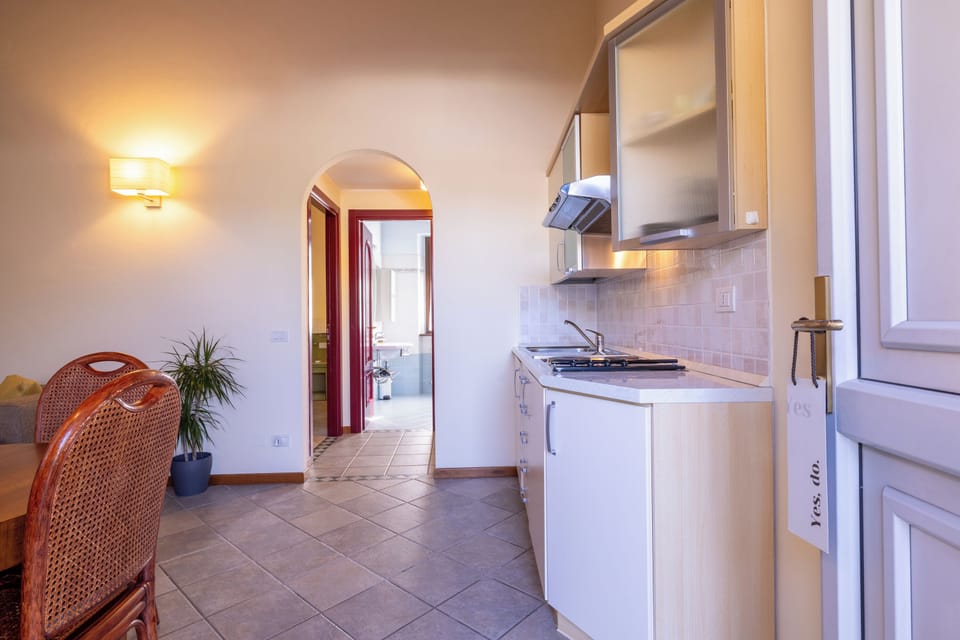 Premium Room, 1 Bedroom | Living area | Flat-screen TV, books