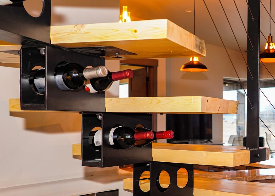 Stairway to loft doubles as a wine rack. One bottle of wine included.
