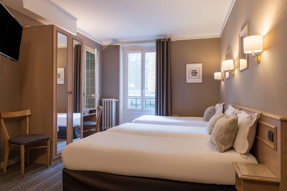 Triple Room | Desk, blackout drapes, iron/ironing board, free WiFi