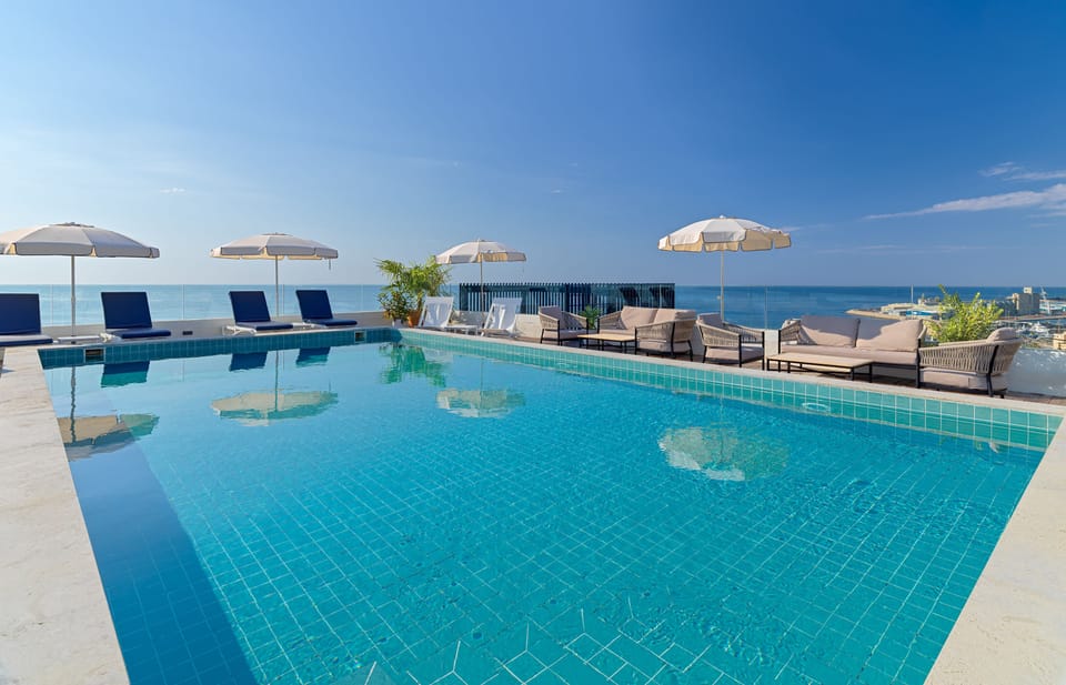 Seasonal outdoor pool, open 11:00 AM to 7:00 PM, sun loungers