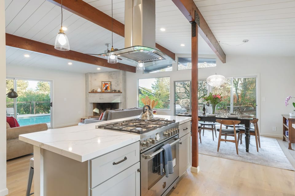 Sleek and modern, this kitchen is a chef's playground, boasting stainless steel appliances and ample marble countertops for culinary creativity.
