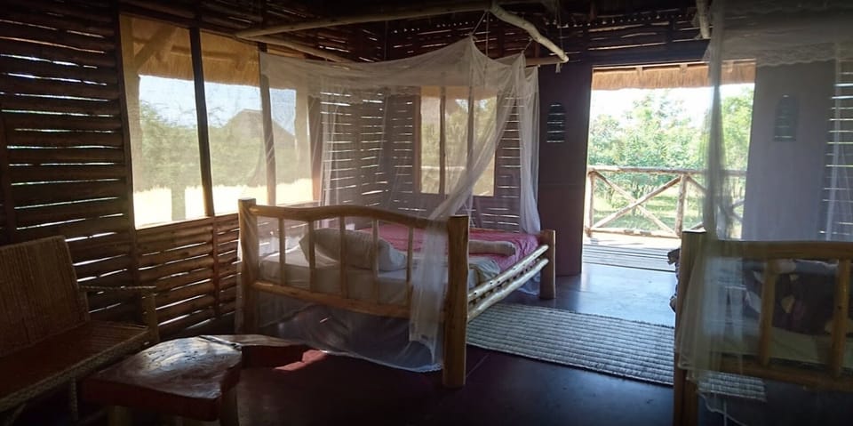 Desk, laptop workspace, iron/ironing board, bed sheets