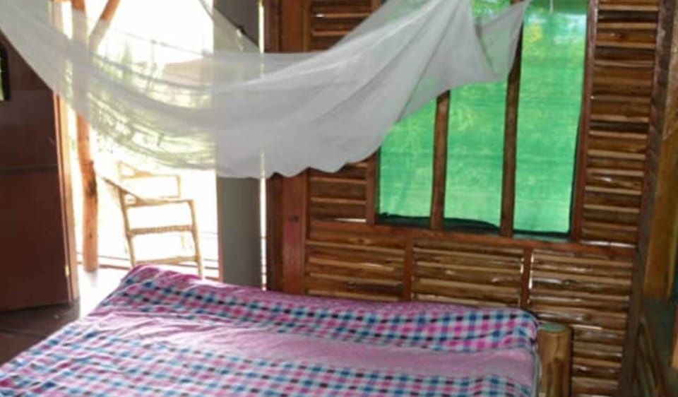 Desk, laptop workspace, iron/ironing board, bed sheets