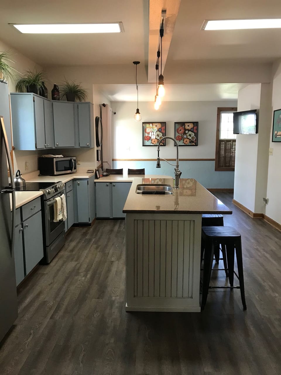 The open concept kitchen/family room allow everyone to be part of the convo!