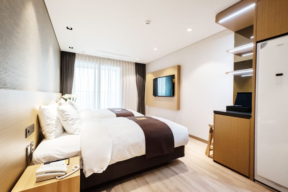 Premium bedding, down comforters, desk, laptop workspace