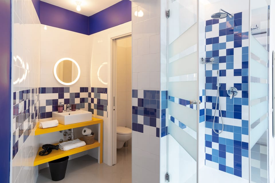 Room, City View (Room 03) | Bathroom | Shower, rainfall showerhead, hair dryer, bathrobes