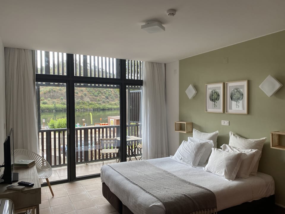 Double or Twin Room, Balcony, River View | Minibar, soundproofing, free cribs/infant beds, rollaway beds