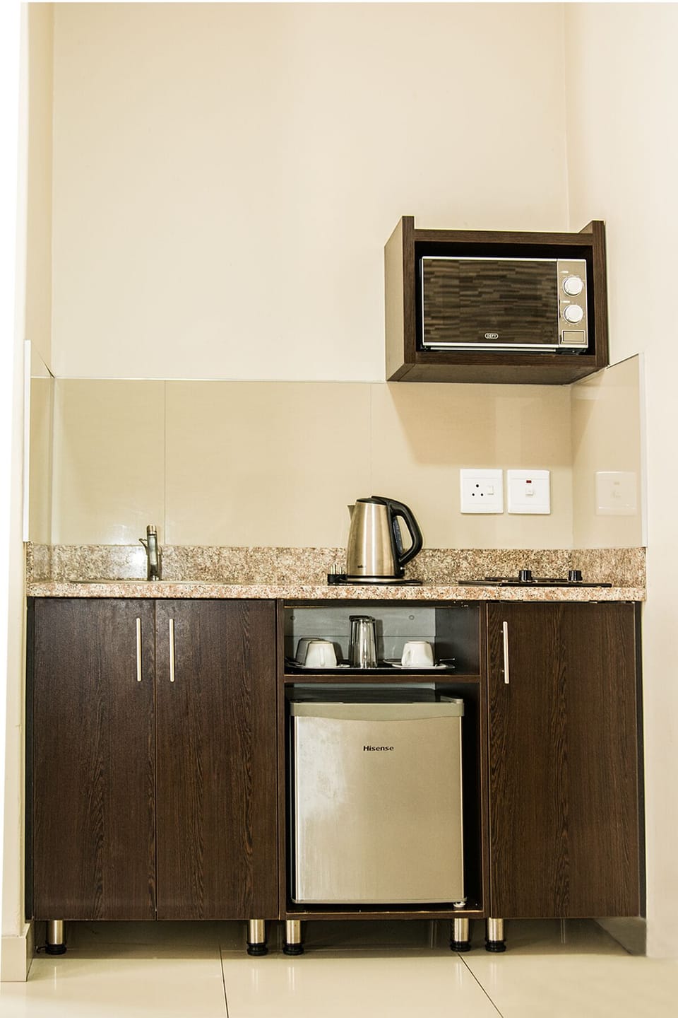 Mini-fridge, microwave, stovetop, coffee/tea maker