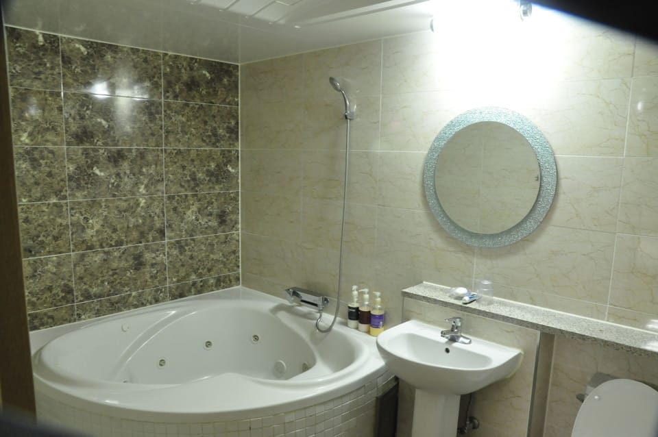 Deluxe Room - Extra person charge 10,000 KRW on site more than 2 people | Bathroom | Free toiletries, hair dryer, bathrobes, slippers