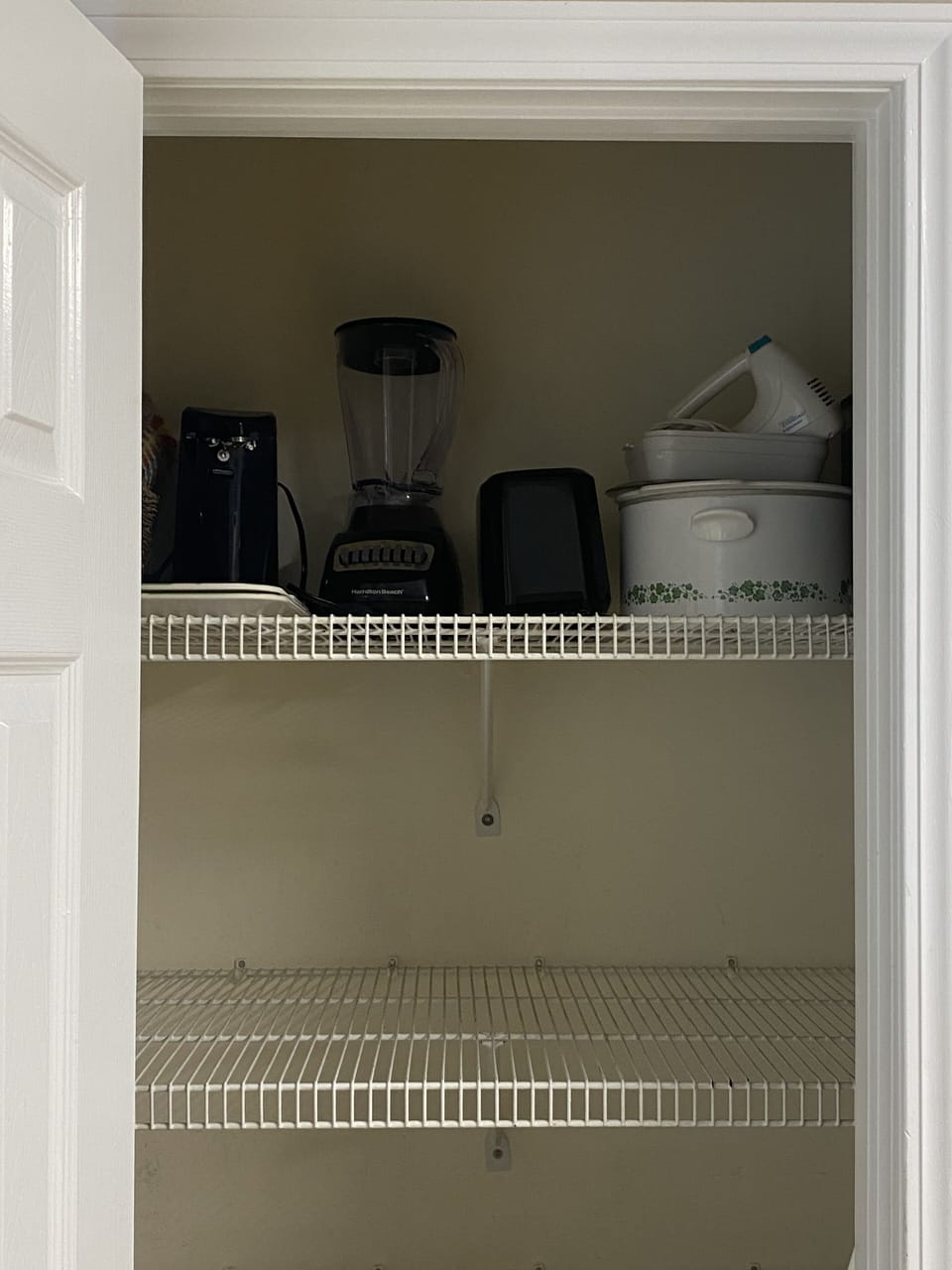 Blender, crockpot, can opener, toaster and mixer in the pantry for guests to use