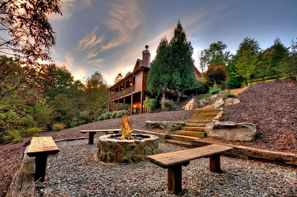 Outdoor landscape and professionally hardscaped with boulders and evergreens