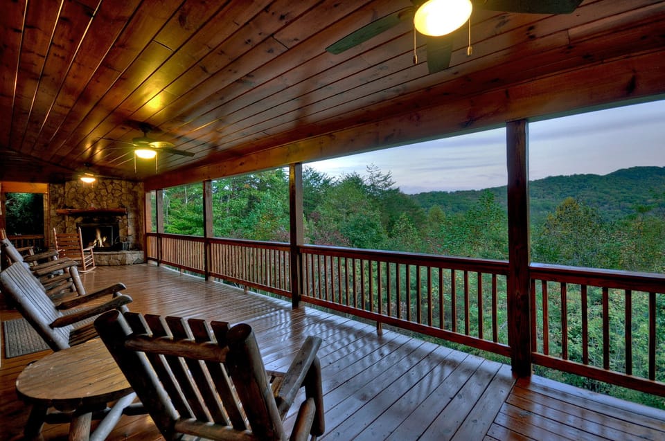 Outdoor fire place on wrap around spacious porch