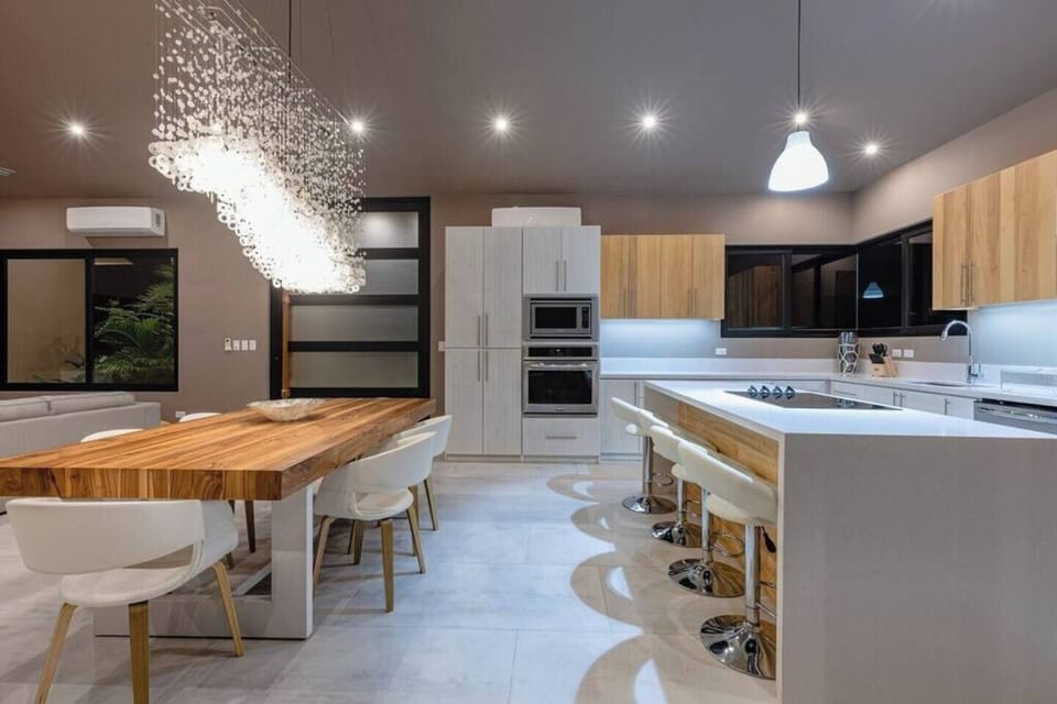 Clean lines of a modern equipped kitchen with Silestone quartz countertops 