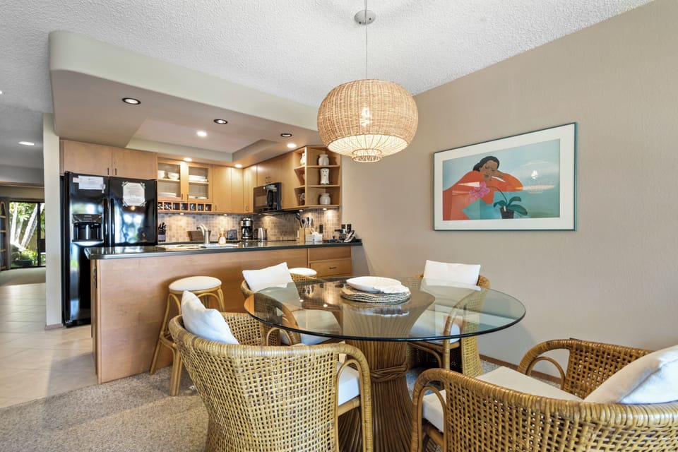 Gather around this inviting glass-top table where your group can share meals and make memories. The open kitchen and warm coastal design create a relaxed, effortless vibe for your stay.