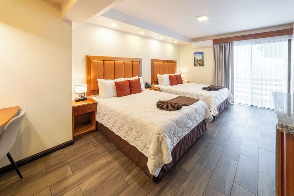 Quetzal 2 Beds | Premium bedding, down comforters, pillowtop beds, in-room safe