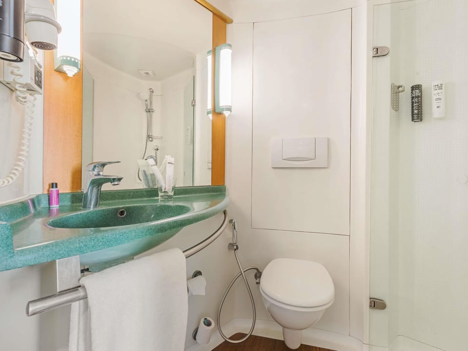 Shower, eco-friendly toiletries, hair dryer, slippers