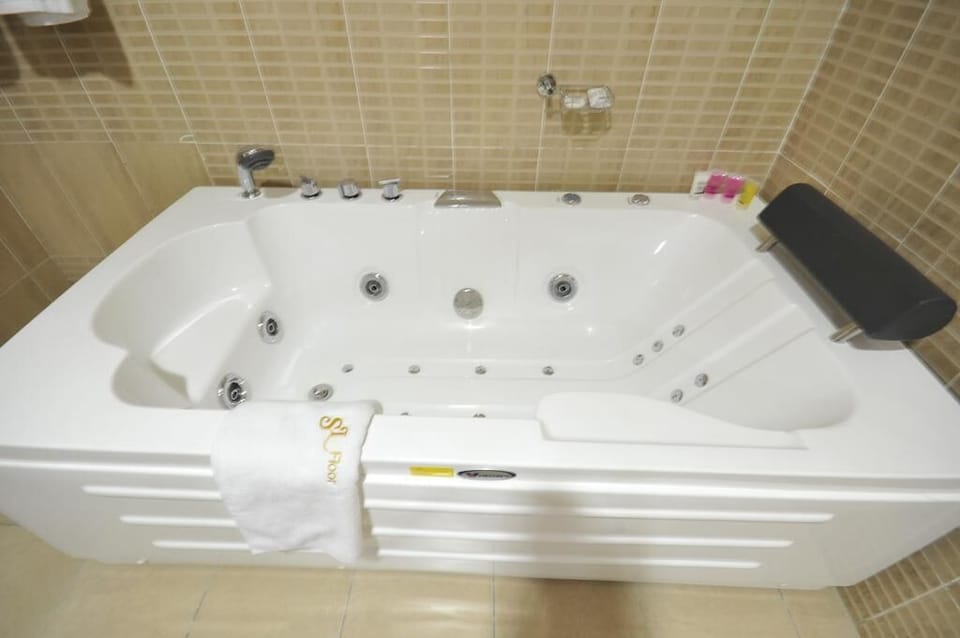 Separate tub and shower, towels, soap, toilet paper