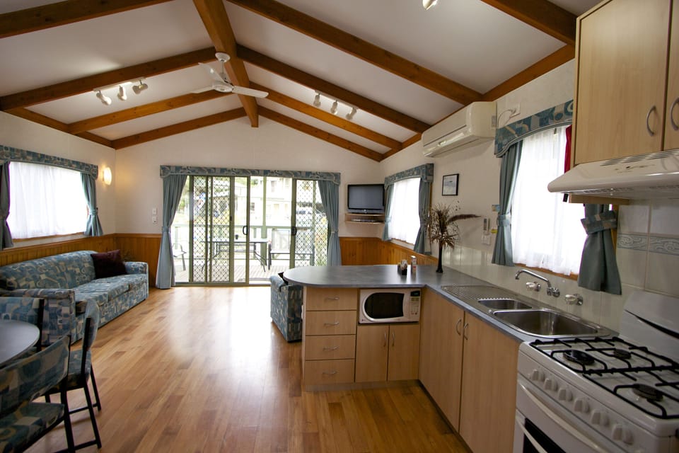 Deluxe Villa, 2 Bedrooms | Living area | 32-inch flat-screen TV with digital channels, TV, DVD player