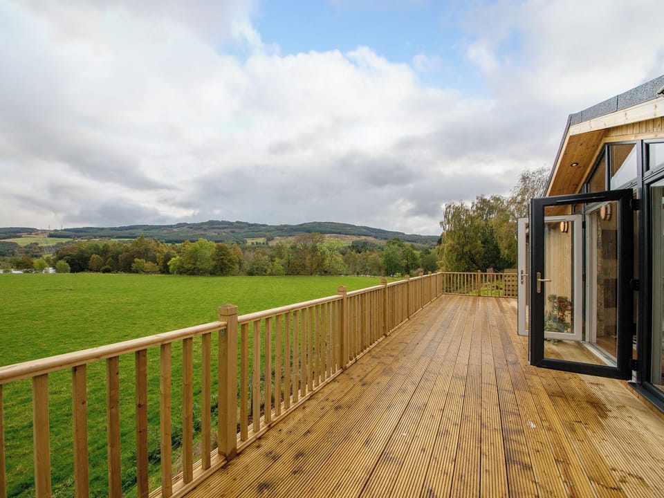 Outstanding holiday home with large decked terrace | Karelia Lodge, Keltyneyburn, near Aberfeldy