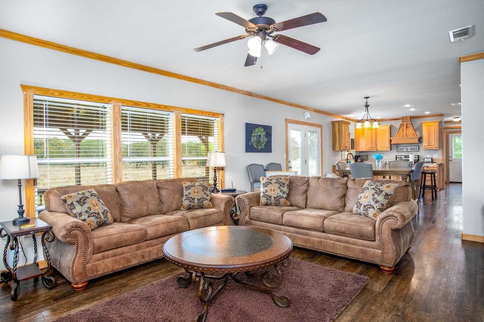 With super-comfortable furniture and a spacious open-floor plan, everyone's part of the conversation between the living area, dining area, and kitchen.