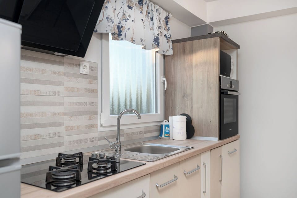 Villa | Private kitchen | Fridge, microwave, oven, stovetop