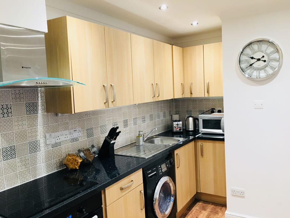Fountain View Apartment | Private kitchen | Full-size fridge, microwave, stovetop, coffee/tea maker