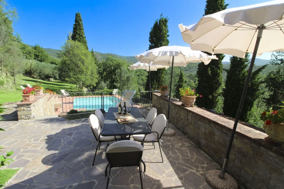 Ancient stone hamlet in an extremely panoramic position overlooking the wooded Val di Chio. Private Villa in Tuscany