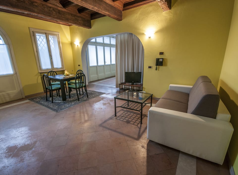 Studio, Garden View | Living area | Flat-screen TV