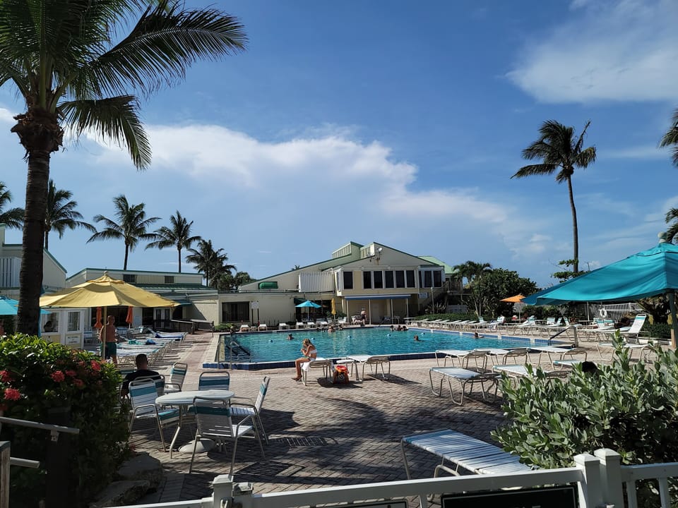 Large GeoThermal cooled pool with Tiki Bar, Sports Lounge and steps to ocean.