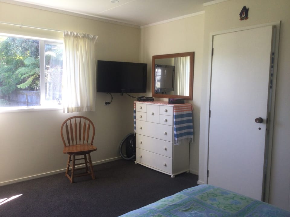 Spacious bedroom with a queen bed. Plenty of space for a portacot if needed